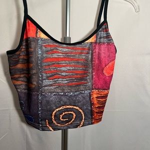 Fun and silky patterned tank top. Measurements in photos. Large. 100% Polyester.